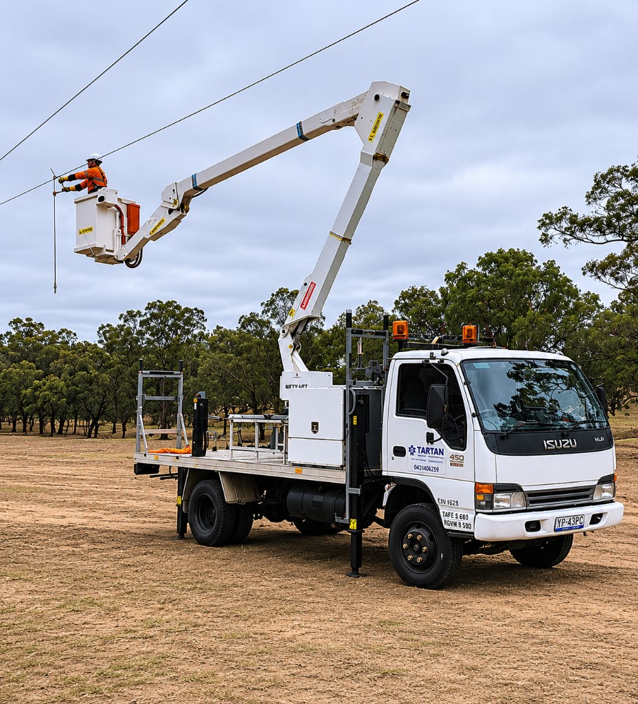 Tartan Electrical Level 2 ASP technician working from an elevated bucket truck on overhead power lines