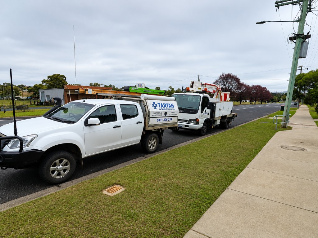 Tartan Electrical & Maintenance service ute and Level 2 ASP bucket truck on site